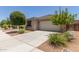 Well maintained single-story home featuring a two-car garage and low maintenance desert landscaping at 12109 W Tether Trl, Peoria, AZ 85383