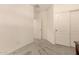 Bright hallway with neutral walls, plush carpet, and ample closet space at 12109 W Tether Trl, Peoria, AZ 85383