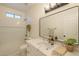 Bathroom showcasing updated fixtures, a new vanity, and tiled shower-tub combo at 125 N 22Nd Pl # 5, Mesa, AZ 85213