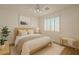 Calm bedroom features a ceiling fan, a cozy bed, and plantation shutters for natural light at 125 N 22Nd Pl # 5, Mesa, AZ 85213