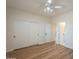 Spacious bedroom with a ceiling fan, closet and view to bathroom at 125 N 22Nd Pl # 5, Mesa, AZ 85213