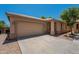 Charming single-story home with a tile roof, spacious driveway, and two-car garage at 125 N 22Nd Pl # 5, Mesa, AZ 85213