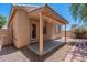 Exterior of the property featuring a covered patio and desert landscaping at 125 N 22Nd Pl # 5, Mesa, AZ 85213