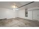 A spacious two car garage featuring a water heater and extra room for storage solutions at 125 N 22Nd Pl # 5, Mesa, AZ 85213