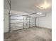 An attached garage with insulated door and concrete flooring provides secure vehicle storage at 125 N 22Nd Pl # 5, Mesa, AZ 85213