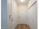 Hallway featuring wood flooring, a closet, and access to other parts of the house at 125 N 22Nd Pl # 5, Mesa, AZ 85213
