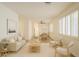 Inviting living room and dining room featuring neutral tones, wood floors, and shuttered windows at 125 N 22Nd Pl # 5, Mesa, AZ 85213
