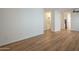 Large living room with hard surface flooring, neutral walls, and transitions to other areas at 125 N 22Nd Pl # 5, Mesa, AZ 85213