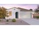 Charming single-story home with a two-car garage, stucco finish, and desert landscaping at 12561 W Trumbull Rd, Avondale, AZ 85323