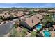 View of a stunning desert home with a private pool and lush landscaping in a gated community at 12638 E Cortez Dr, Scottsdale, AZ 85259