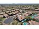 The aerial view reveals luxurious desert homes with private pools amidst lush desert landscaping at 12638 E Cortez Dr, Scottsdale, AZ 85259