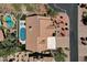 Aerial view showcasing the property with pool, patio, and meticulous landscaping at 12638 E Cortez Dr, Scottsdale, AZ 85259