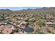Aerial view of a desert community with mountain views and private pools at 12638 E Cortez Dr, Scottsdale, AZ 85259
