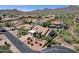 Aerial view of homes in a desert community with mountain views at 12638 E Cortez Dr, Scottsdale, AZ 85259