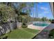 Backyard view with pool, lounge chairs, and manicured lawn at 12638 E Cortez Dr, Scottsdale, AZ 85259