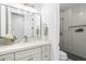 Stylish bathroom featuring a vanity with marble countertop and tiled shower at 12638 E Cortez Dr, Scottsdale, AZ 85259