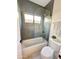 Stylish full bathroom showcases elegant tile work, glass-enclosed shower, and contemporary fixtures at 12638 E Cortez Dr, Scottsdale, AZ 85259