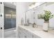 Bathroom boasting marble countertops, vanity, and a shower-tub combo with blue tile at 12638 E Cortez Dr, Scottsdale, AZ 85259