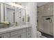 Bathroom features marble countertops, gold fixtures, and a tile shower with glass door at 12638 E Cortez Dr, Scottsdale, AZ 85259