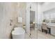 Bathroom boasting a soaking tub, glass shower, vanity and view into the main bedroom at 12638 E Cortez Dr, Scottsdale, AZ 85259