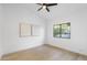 Minimalist bedroom featuring hardwood floors, neutral paint and modern light fixtures at 12638 E Cortez Dr, Scottsdale, AZ 85259