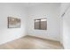 Bright bedroom features light hardwood floors, modern art and a window at 12638 E Cortez Dr, Scottsdale, AZ 85259