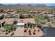 An eye-level view of a well-maintained desert home with a two car garage and mountain views at 12638 E Cortez Dr, Scottsdale, AZ 85259