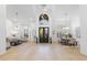 Impressive foyer with soaring ceilings, grand chandelier, and views of the living and dining areas at 12638 E Cortez Dr, Scottsdale, AZ 85259