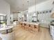 Open concept kitchen boasts large center island, stone countertops, stainless appliances and seamless flow to living space at 12638 E Cortez Dr, Scottsdale, AZ 85259