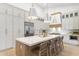 Gourmet kitchen boasts a spacious island, modern cabinetry, stainless appliances, and stylish lighting at 12638 E Cortez Dr, Scottsdale, AZ 85259