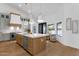 Gourmet kitchen with a large island, marble countertops, stainless steel appliances, and pendant lighting at 12638 E Cortez Dr, Scottsdale, AZ 85259