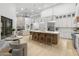 Bright open-concept kitchen features a large island, breakfast bar, stainless appliances, and pendant lighting at 12638 E Cortez Dr, Scottsdale, AZ 85259