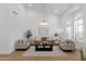 Spacious living room featuring vaulted ceilings, lots of natural light, and modern furnishings at 12638 E Cortez Dr, Scottsdale, AZ 85259
