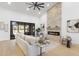 Spacious living room with fireplace, sliding glass doors to the outdoors, and contemporary decor at 12638 E Cortez Dr, Scottsdale, AZ 85259