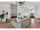 Spacious living room with fireplace, access to the pool and modern furniture at 12638 E Cortez Dr, Scottsdale, AZ 85259