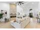 Living room with fireplace, high ceilings, and views into the dining room and entry at 12638 E Cortez Dr, Scottsdale, AZ 85259