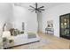 Bright main bedroom with a ceiling fan and light colored walls at 12638 E Cortez Dr, Scottsdale, AZ 85259