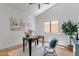 Home office features a vaulted ceiling, neutral decor, and a view to the exterior at 12638 E Cortez Dr, Scottsdale, AZ 85259