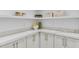 Pantry featuring white cabinets and marble countertop at 12638 E Cortez Dr, Scottsdale, AZ 85259