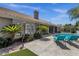 Rear exterior showcasing the pool, patio, and landscaped yard at 12638 E Cortez Dr, Scottsdale, AZ 85259
