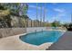Sparkling pool features a modern water feature and tanning ledge at 12638 E Cortez Dr, Scottsdale, AZ 85259