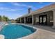 Inviting pool with views of the home, a covered patio, and lush landscaping at 12638 E Cortez Dr, Scottsdale, AZ 85259