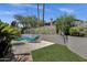 Resort-style pool area with sun loungers and lush landscaping at 12638 E Cortez Dr, Scottsdale, AZ 85259