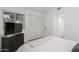 Bright bedroom featuring wood floors, closet, and modern TV at 13237 N 25Th Dr, Phoenix, AZ 85029