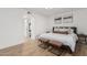 Stylishly furnished bedroom with wood-look tile flooring, neutral decor and closet at 13237 N 25Th Dr, Phoenix, AZ 85029
