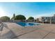 Community pool with fence and landscaped common area at 13237 N 25Th Dr, Phoenix, AZ 85029