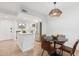 Contemporary kitchen with modern island, stainless appliances, and a dining area for meals at 13237 N 25Th Dr, Phoenix, AZ 85029