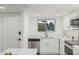 Bright kitchen with stainless steel appliances, white cabinetry and quartz countertops at 13237 N 25Th Dr, Phoenix, AZ 85029