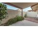 Enclosed patio with stucco wall and flowering plants at 13237 N 25Th Dr, Phoenix, AZ 85029
