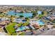 Beautiful aerial view of the community with a lake, tennis courts, and pool area at 1331 W Baseline Rd # 360, Mesa, AZ 85202